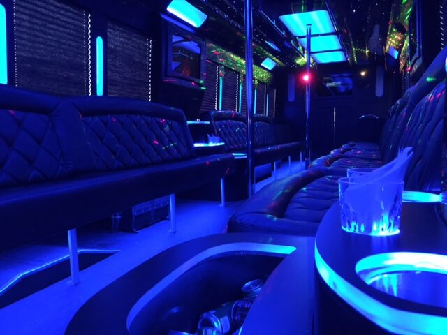 The ACES party bus features dual dance poles