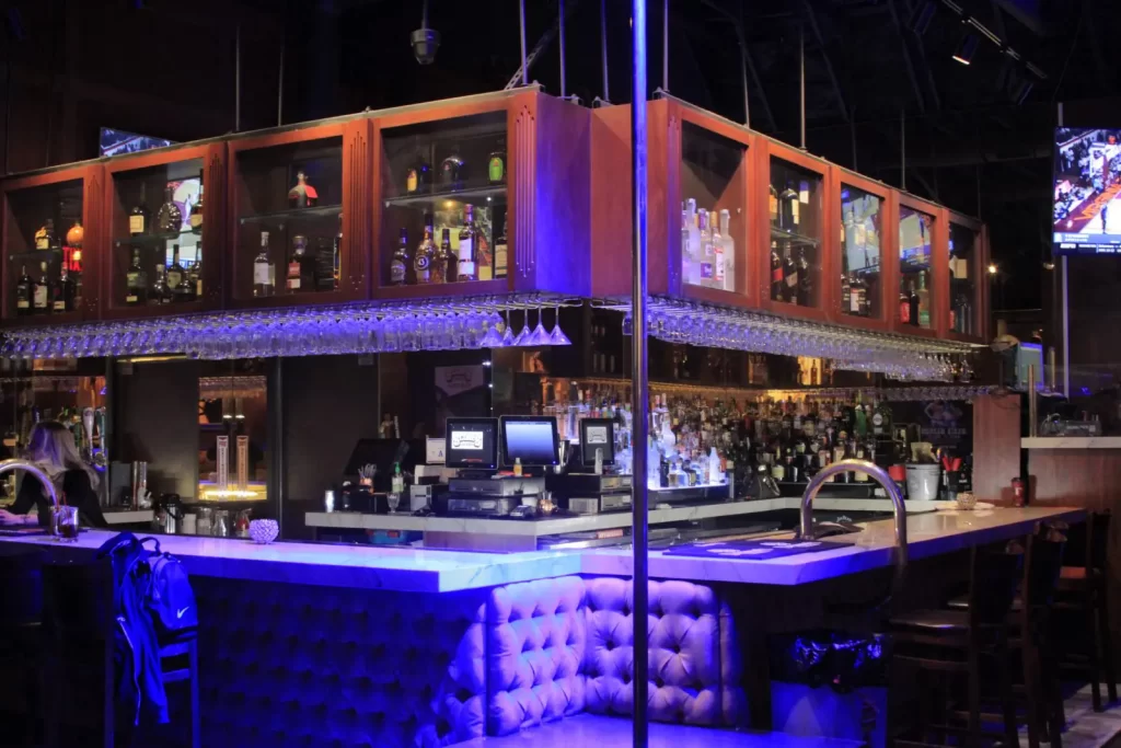 Bar and main stage with stripper pole inside Scores Las Vegas