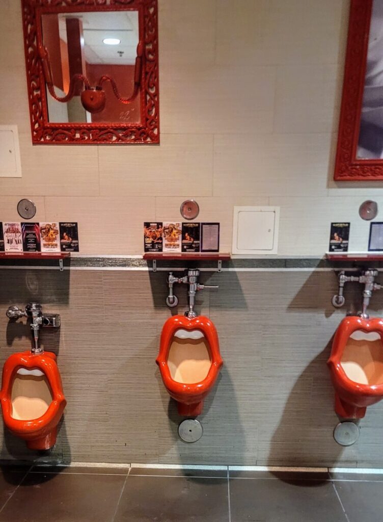 The Urinals at Hustler Gentlemen's Club in Las Vegas are shaped like a woman's open mouth with red lips