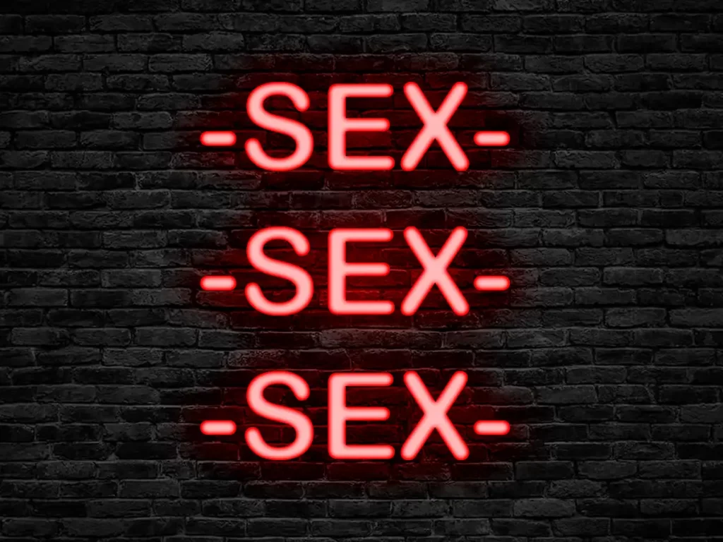 Red neon sign saying "SEX SEX SEX"