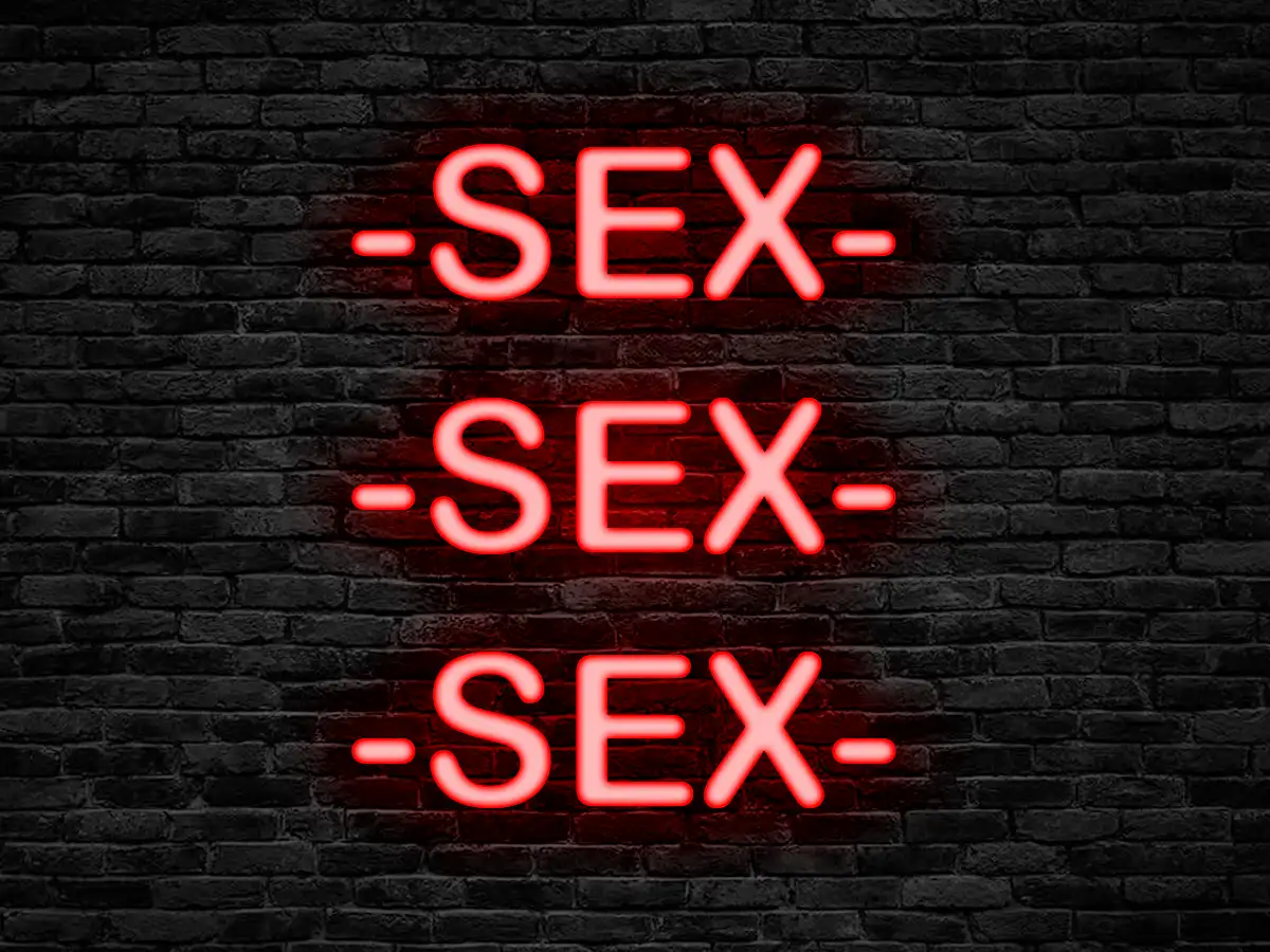 Red neon sign saying "SEX SEX SEX"